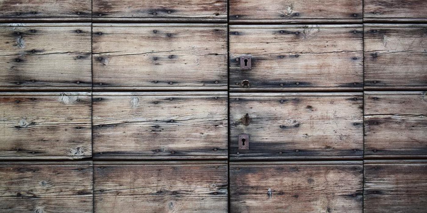 A wall of shallow wooden drawers fitted with plain metal pulls.