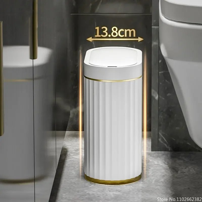 The bin standing narrow-side-on in the gap between a shower screen and a toilet, with a 13.8 cm arrow above it