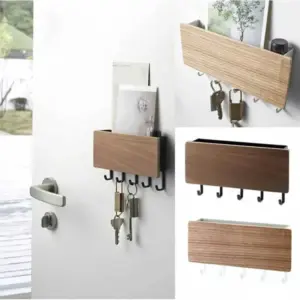Walnut-look key holder with shelf mounted beside a front door, letters in the tray and keys and padlocks on the five hooks