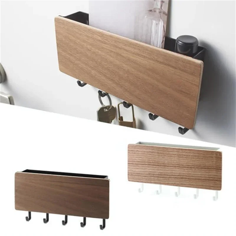 Angled view of the walnut-look key rack holding keys, with the black-framed and white-framed versions shown below