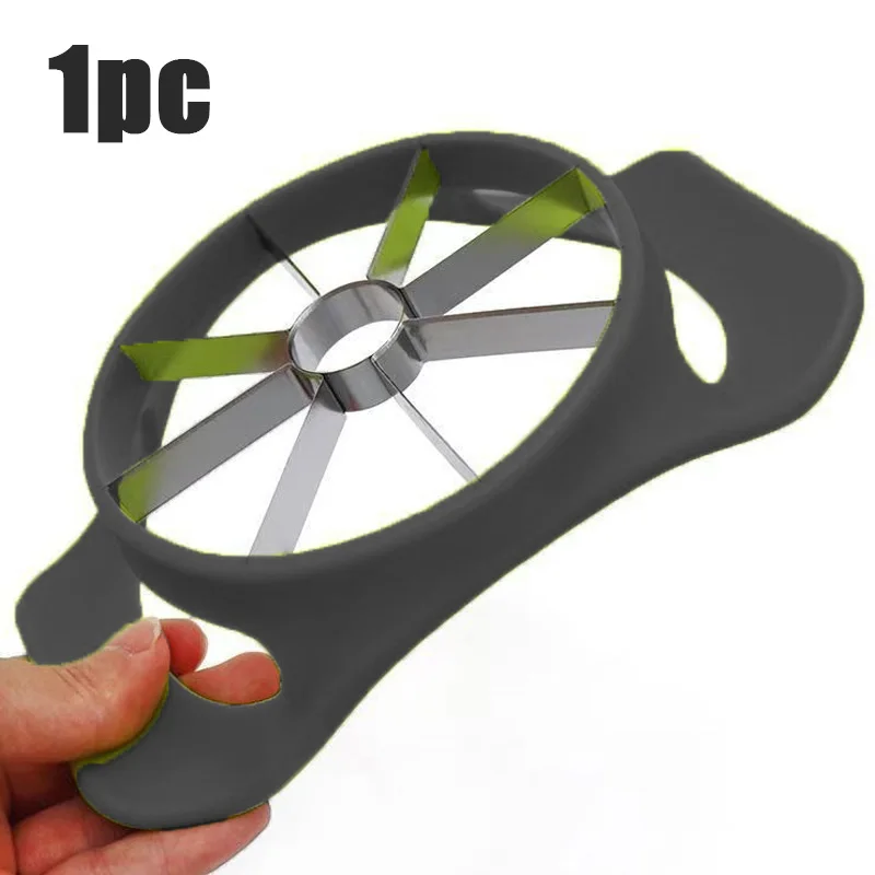Hand holding the apple slicer by one side handle, labelled 1pc, showing the eight blades and central coring ring
